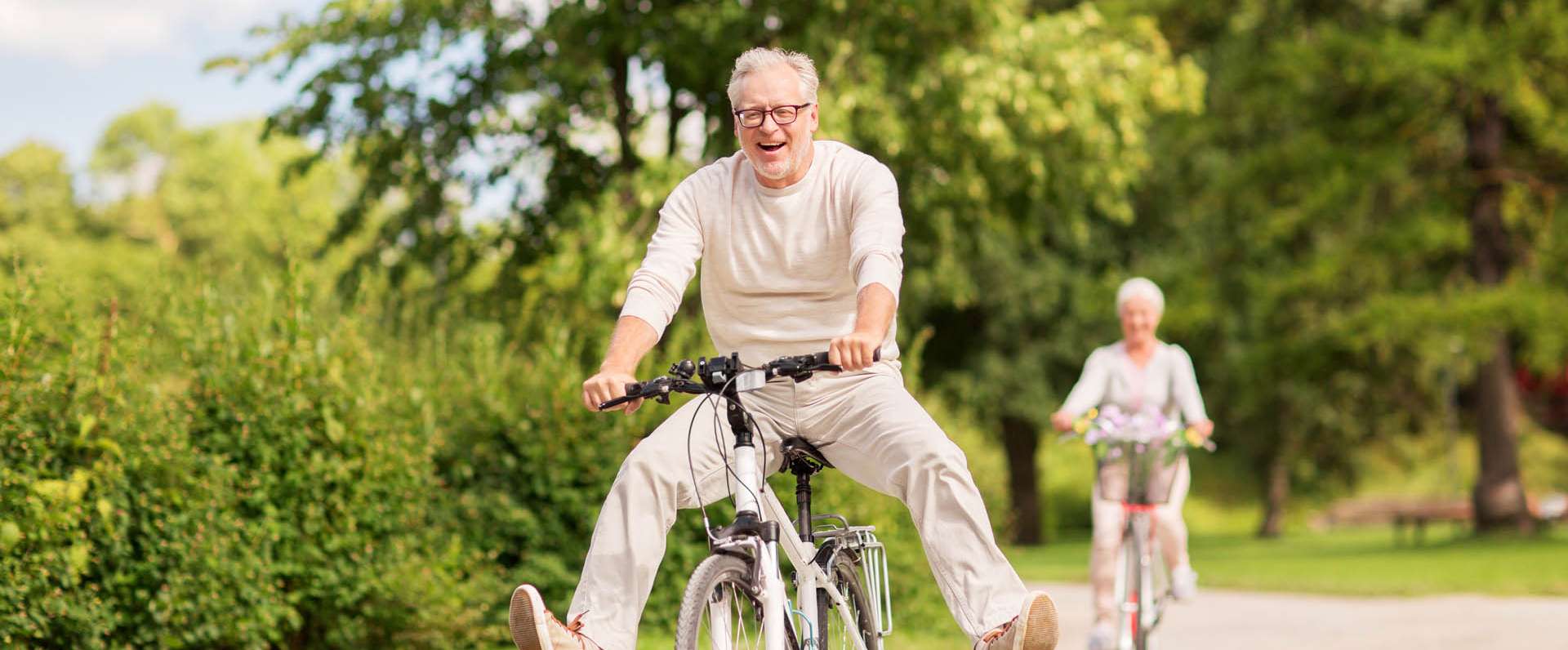 couple riding bikes because they have Medicare coverage